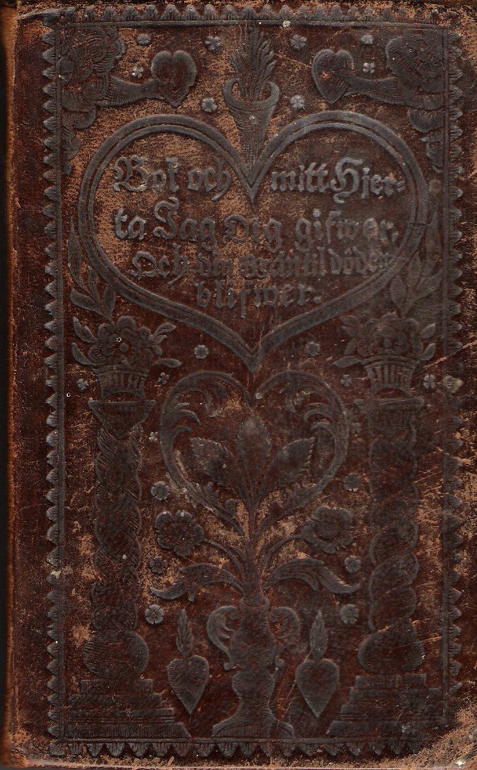 Det präglade omslaget till en svensk psalmbok från 1819.